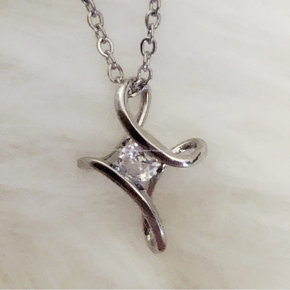 925 Sterling Silver Swirly Cross Necklace with 1/4ct Synthetic Diamond - Picture 8 of 9